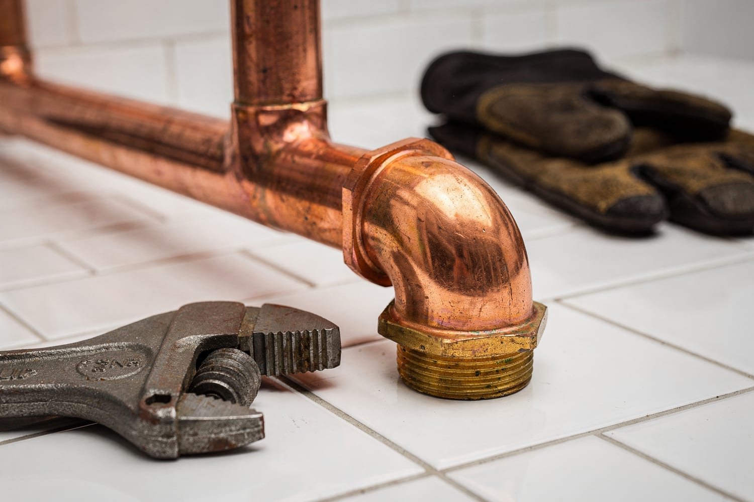 Close detail of polished copper pipe fittings, the mark of clean work